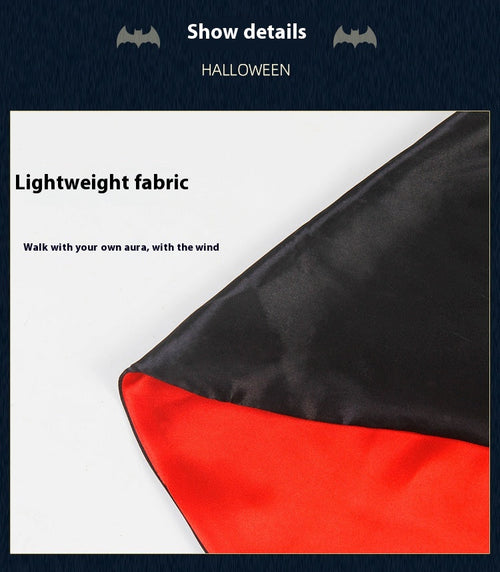 Close-up showing the black outer fabric and red lining of the vampire cape.