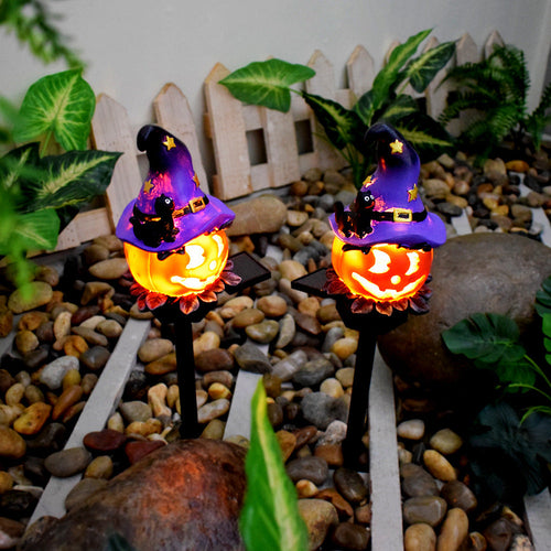 Elevated view of Wizard Pumpkin stakes showing their solar panels; one stake per order.
