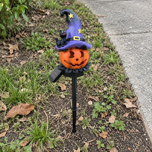Wizard Pumpkin solar stake beside a garden path — AI-generated lifestyle scene.